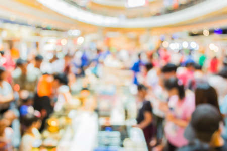 image of blur people at pet show in hall for background usage .