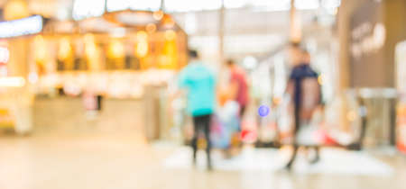 blur image of escalators at the modern shopping mall for background usage.の写真素材