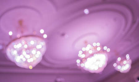 image of blur  chandelier  with bokeh in purple light tone for background usage .の写真素材
