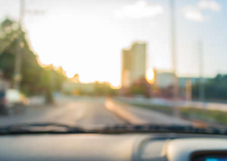 blur image of inside cars to see the road  with bokeh lights for background usage.の写真素材