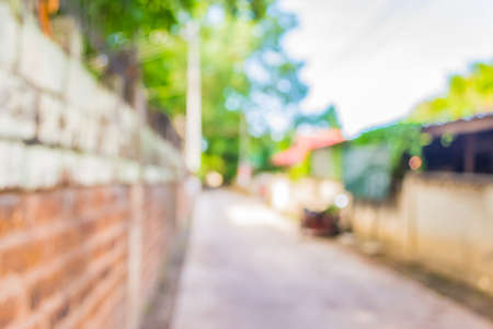 blur image of Long empty corridor with open space to the green garden with bokeh for background usage.の写真素材