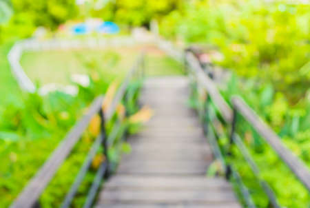 blur image of Long empty corridor with open space to the green garden with bokeh for background usage .の写真素材