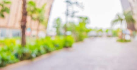 blur image of Long empty corridor with open space to the green garden with bokeh for background usage .の写真素材