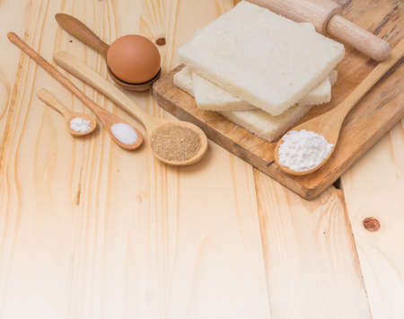 image of different sweet bread ingredient and equipment  on wood table.