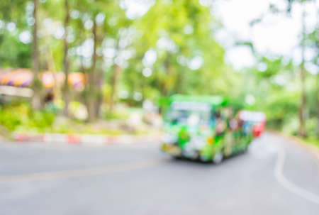 image of blur tram on the road with bokeh .の写真素材