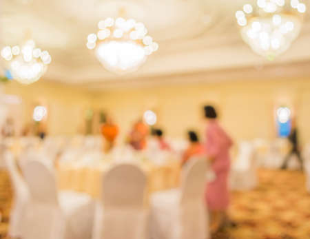 blur image of wedding party  in large hall for background usage.の写真素材