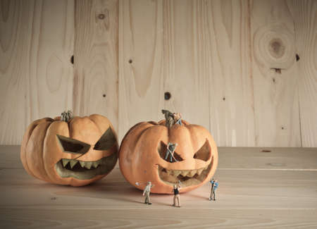vintage color tone image of doll and pumpkin for halloween background.の写真素材