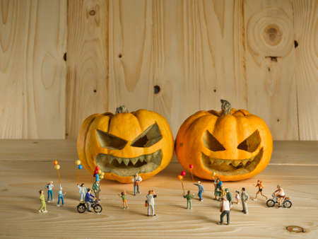 vintage color tone image of doll and pumpkin for halloween background.の写真素材