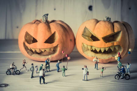 vintage color tone image of doll and pumpkin for halloween background.の写真素材