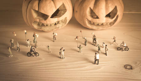 vintage color tone image of doll and pumpkin for halloween background.の写真素材