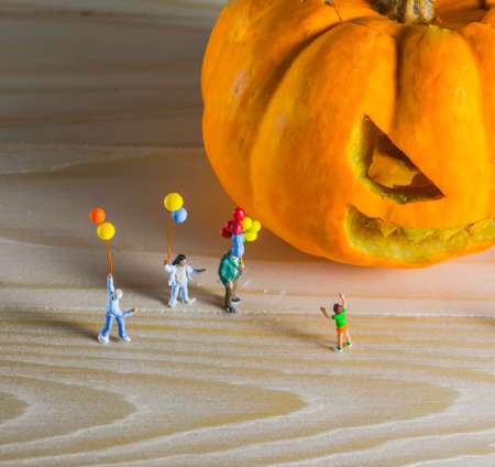 vintage color tone image of doll and pumpkin for halloween background.の写真素材