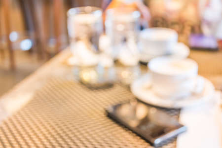 blur image of Business Work With one Smartphone and Coffee cupの写真素材