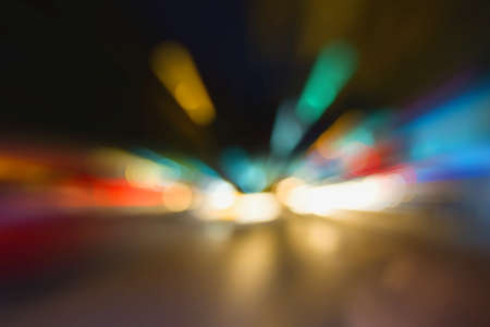 blur image of light of traffic in a street with bokeh for background usage.の写真素材