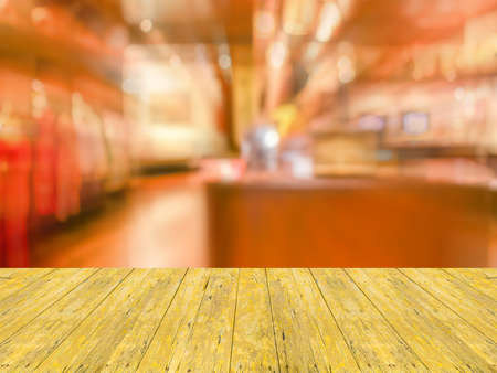 Empty wood table and Coffee shop blur background with bokeh image.の写真素材