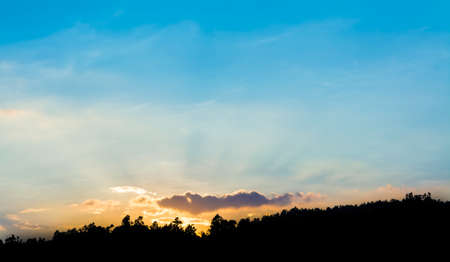 silhouette shot image of mountain and sunset sky in background.の写真素材
