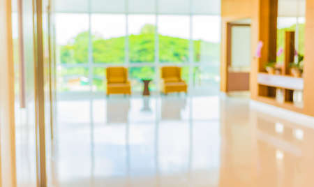 blur image of hospital office room with table and chairs for background usage.の写真素材