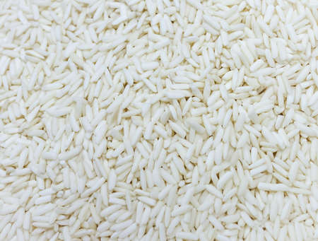 close up shot of white raw rice texture for background usage .の写真素材