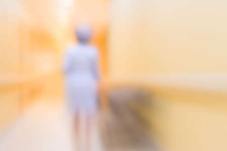 blur image of nurse in hospital walkway for background usage.の写真素材
