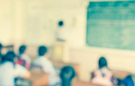 blur kids and teacher in the classroom for background usage.の写真素材