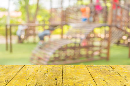 Defocused and blur image of children's playground at public park for background usage.の写真素材