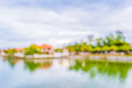 blur image of lake and sunset sky in background .の写真素材