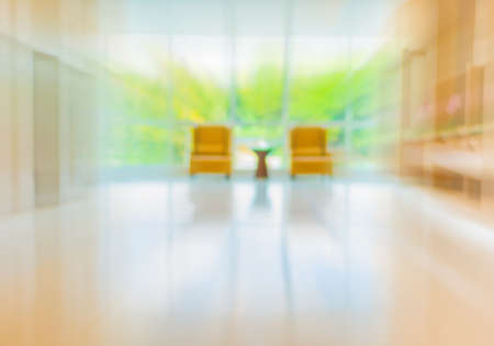 blur image of hospital office room with table and chairs for background usage.の写真素材