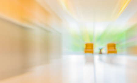 blur image of hospital office room with table and chairs for background usage.