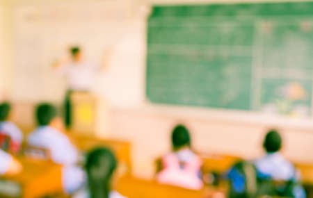 blur kids and teacher in the classroom for background usage.の写真素材