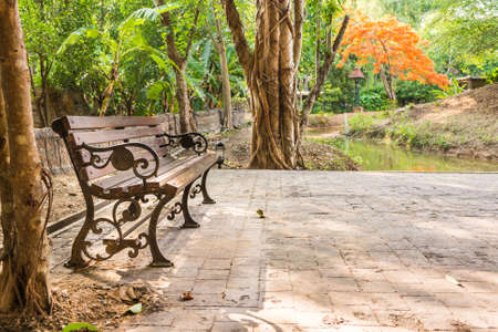 vitage style image of bench in the autumn park.