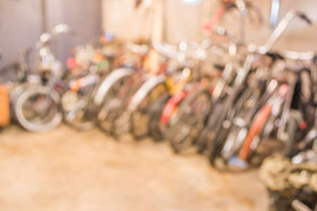 blurred image of lots of parked bikes. Useful as background.の写真素材