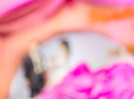 blur image of Thai wedding on purple stage for background usage.の写真素材