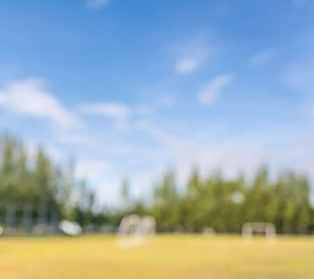 blurred shot of soccer field at school on day time image for background usage.の写真素材