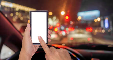 blur image of inside cars with bokeh lights from traffic jam on night time.