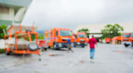image of blur fire trucks 's parking area for background usage .