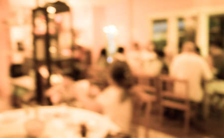 image of blur people at restaurant with vintage tone for background usage .の写真素材