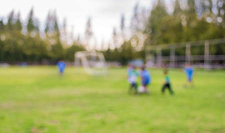 blurred shot of soccer field at school on day time image for background usage.の写真素材