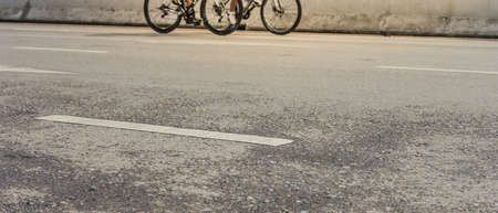 image of asphalt road and bike with sign for background usage .