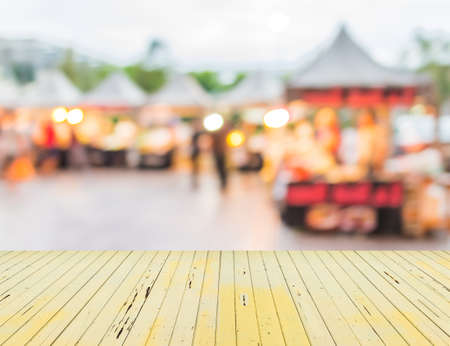 blur image of food store in day festival for background usage.