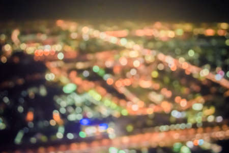 vintage tone blur image of Abstract city bokeh light background
