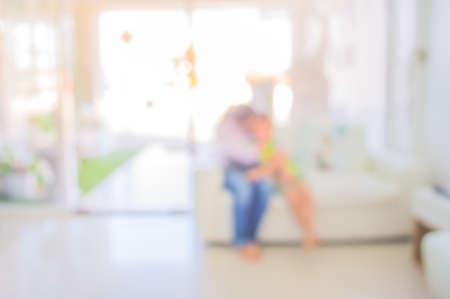 blur image of people sit in living room for background usage .の写真素材