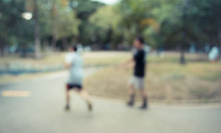 vintage tone Blur image of people activities in park with bokeh on day time for background usage.
