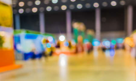 blurred image of people at trade show for background usage .の写真素材