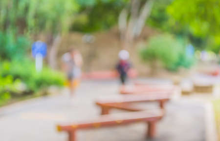 Blur image of people activities in park with bokeh on day time for background usage.の写真素材