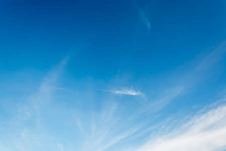 white clouds in the clear blue sky for background usage.