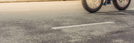 image of asphalt road and bike with sign for background usage .の写真素材