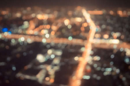 vintage tone blur image of Abstract city bokeh light backgroundの写真素材