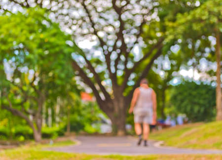 Vintage tone Blur image of people activities in park with bokeh on day time for background usage.の写真素材