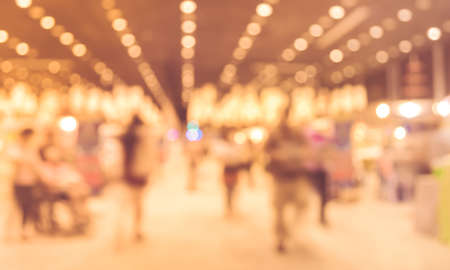 blurred image of people at trade show with vintage tone for background usage .の写真素材