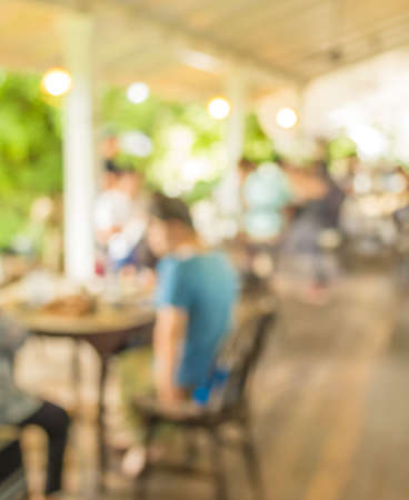 image of blur outdoor restaurant on day time with green tree bokeh for background usage .の写真素材