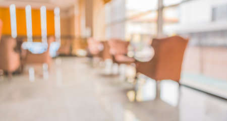 blur image of Beautiful vintage sofa next to window in lobby for background usage.の写真素材